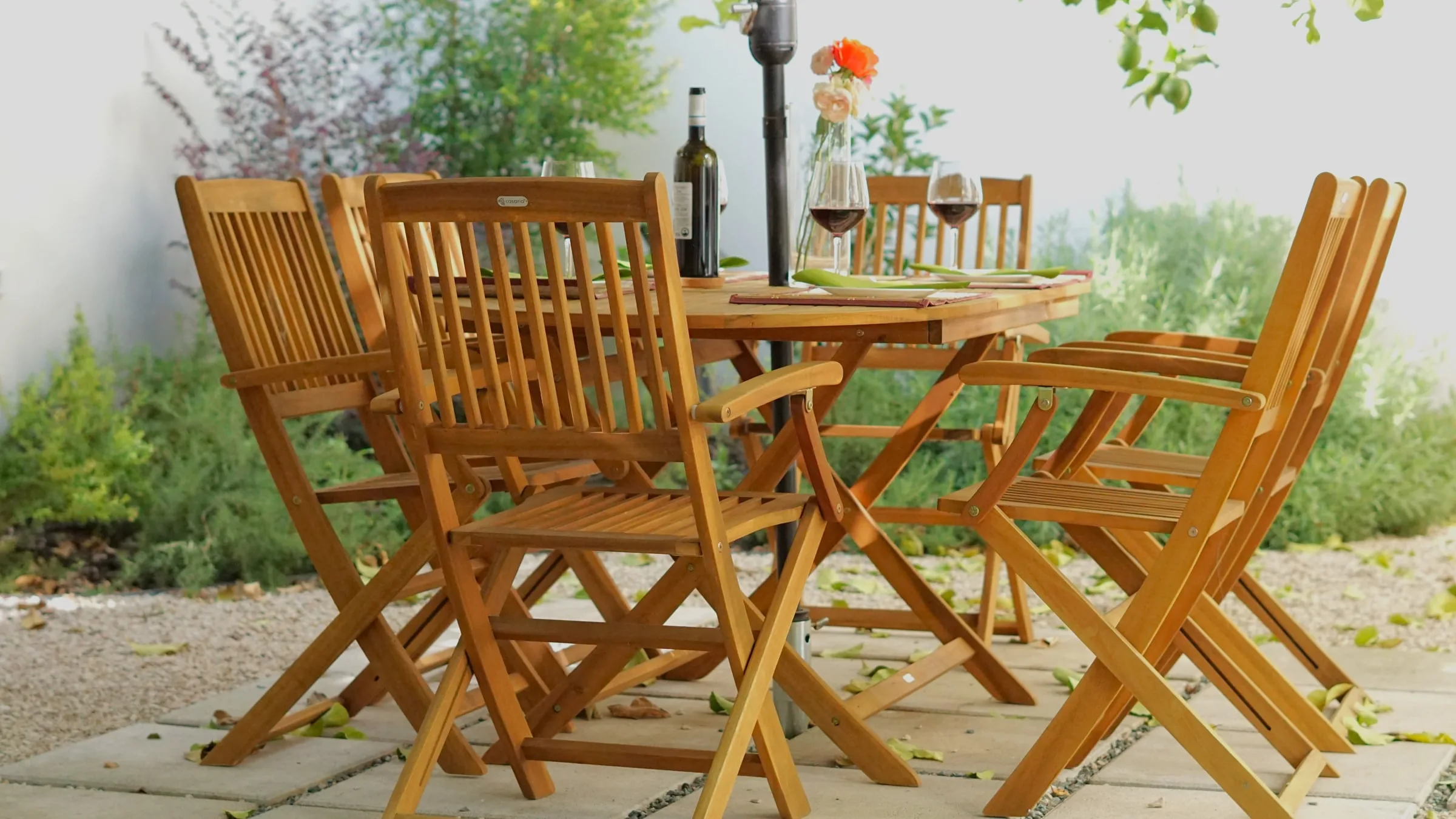 A table laid in the garden of Domus Prete, among the citrus trees